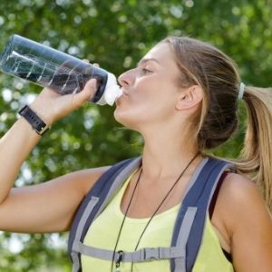 Hiker drink water on a hot weather hike